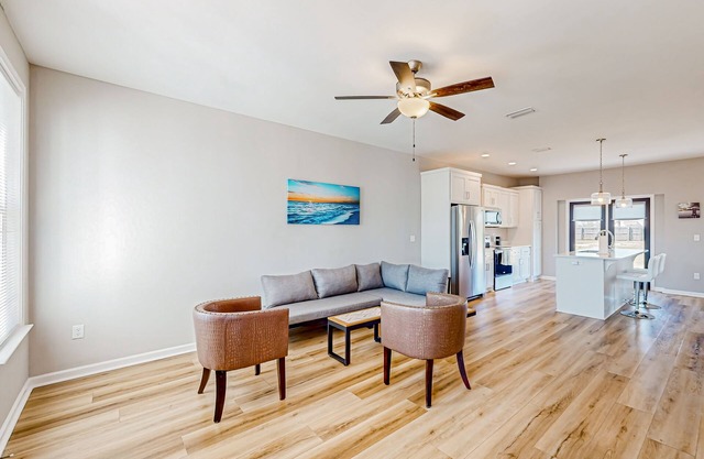Pleasant neighborhood home with open layout, full kitchen, balcony, & central AC