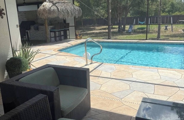Pool house 4 bedroom 2 bath, Playground, ping pong table, foosball table & more.