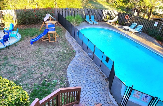 Poolside Retreat - spacious 4-bedroom retreat with pool, hot tub, gym and more