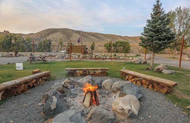 Savor the Beauty of Nature in a Premium Double Queen Room with Inviting Riverfront Access and Picturesque Mountain Views