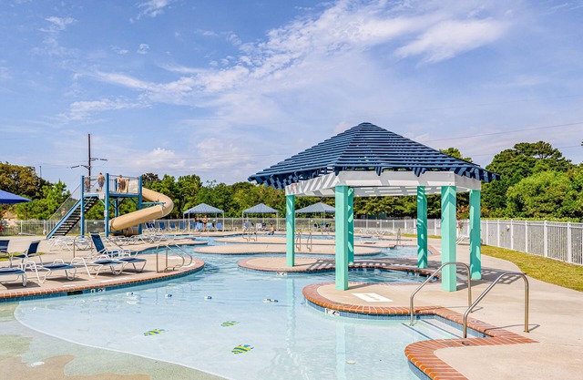 Pristine townhouse with pool access, gas fireplace, washer/dryer, & central AC