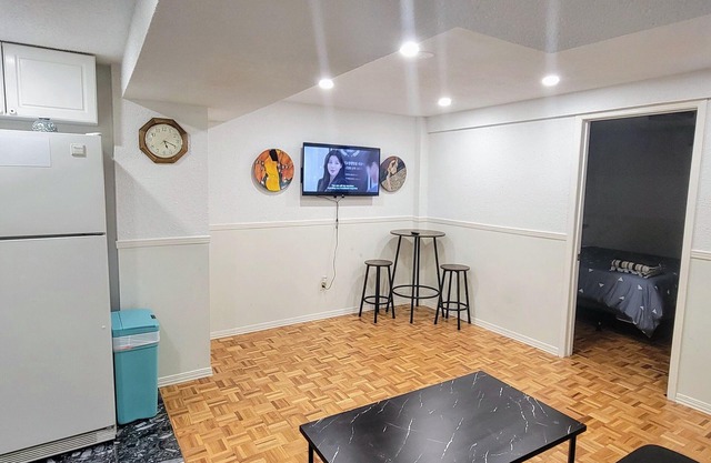 Private 2-bed basement apartment with kitchen & bath. Shared laundry.