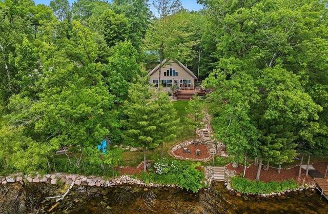 Peaceful private beach house in charming Pound on a clear, sandy full rec lake