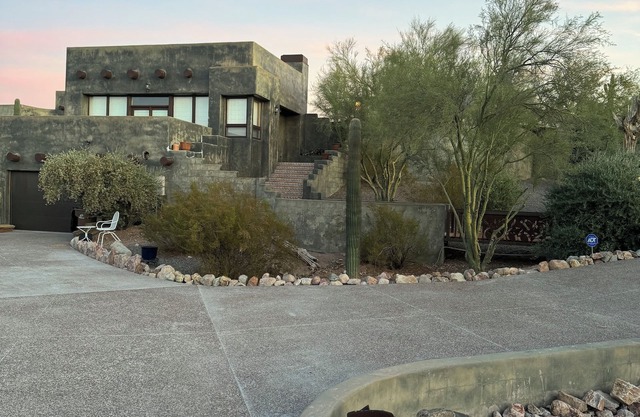 Private home against Superstition Mountains