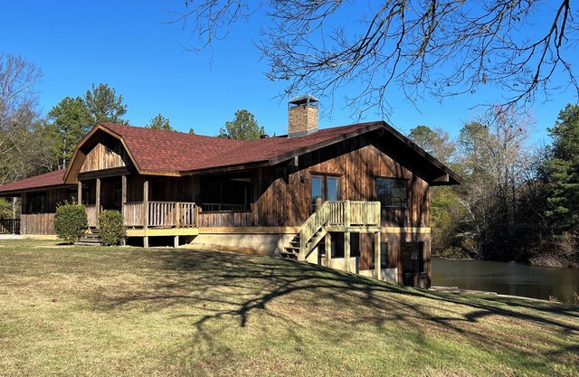 Hot Springs is minutes away from this nicely secluded Lodge & private 5 ac lake!