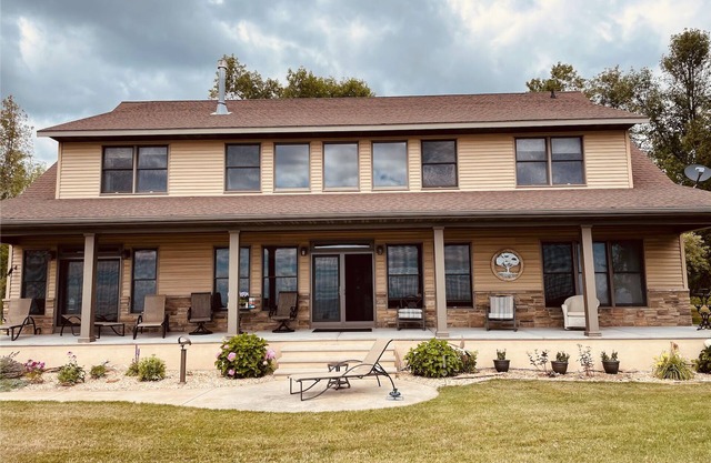 Private lakefront home with 1,200 feet of sandy beach. A year-round retreat.