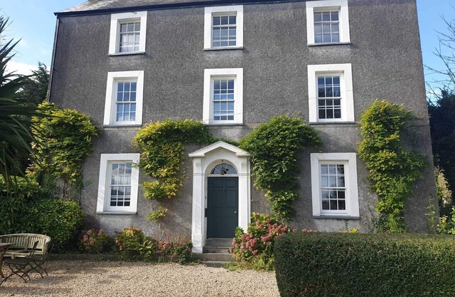 Property looking at Dylan Thomas boat house and Laugharne Castle.