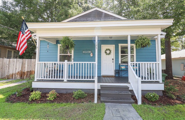Quaint cottage style home with large fenced yard.