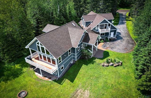 Rare large contemporary four bedroom home with forest and lake views + EV Charge
