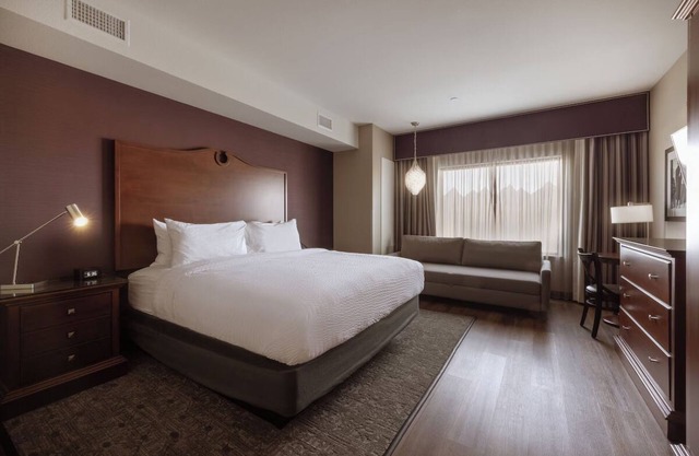 Relaxing Urban Escape with Cozy Beds and Calming Decor