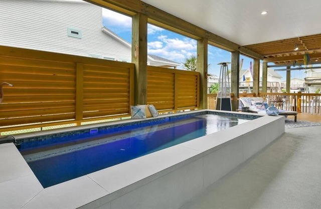 Remarkable home w/ pool, large balcony, and canal views