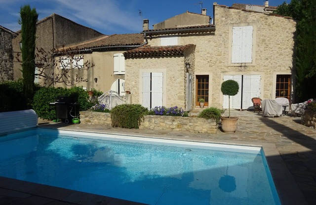 Renovated stone house with private walled garden, heated pool, in quiet village.