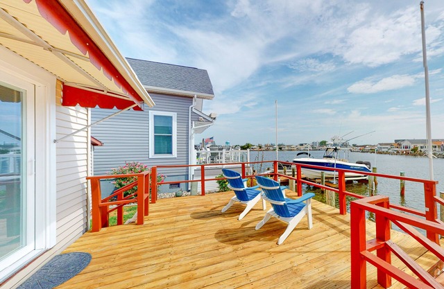 Renovated waterfront home with dock, bay access, & shared pool/tennis