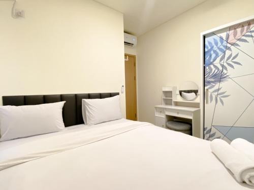 Restful and Modern Look 2BR at Meikarta Apartment By Travelio