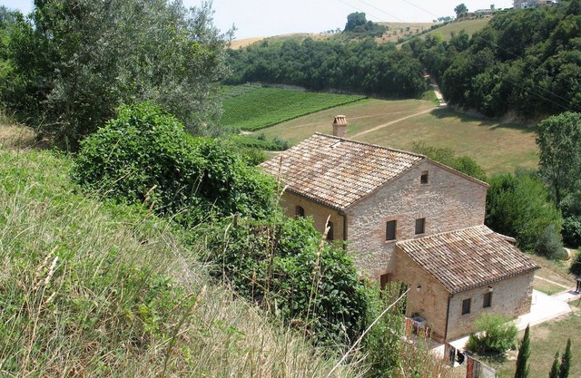 Restored Farmhouse nestling on side of small valley with view to the sea