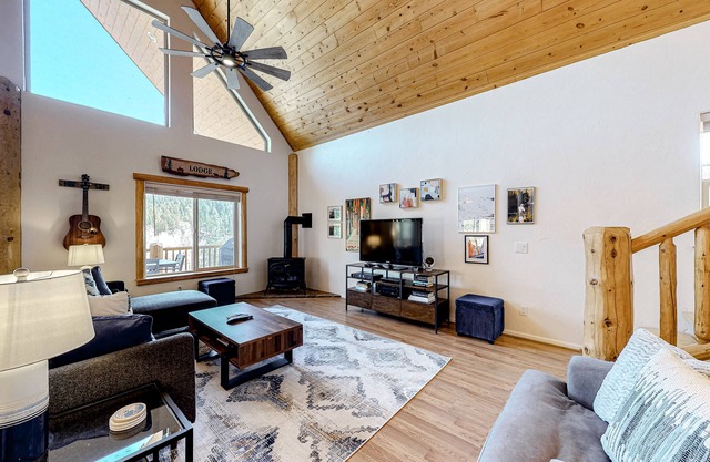 Riverfront home with amazing mountain view, private hot tub, deck & fireplace