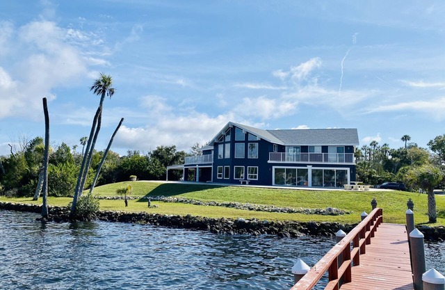 Riverfront views. Sleeps 12 with private dock.