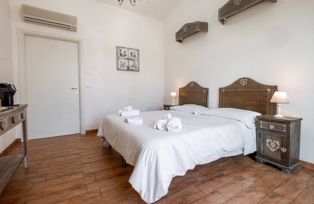 Habitación 'Alloro' con piscina compartida, Wi-Fi y aire acondicionado