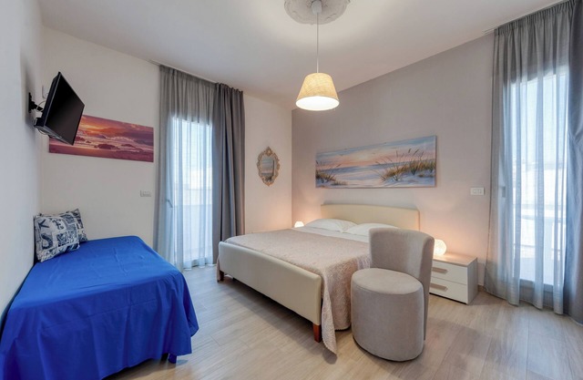 Habitación 'Donna Riccia' con terraza compartida, Wi-Fi y aire acondicionado.