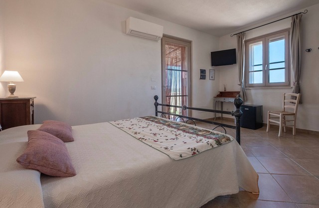 Habitación 'Giusti - 5 Sughera' con jardín compartido, Wi-Fi y aire acondicionado.