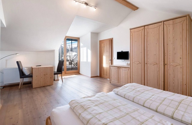 Habitación 'Mairhof Acht Gipfel' con vistas a la montaña, terraza privada y jardín compartido