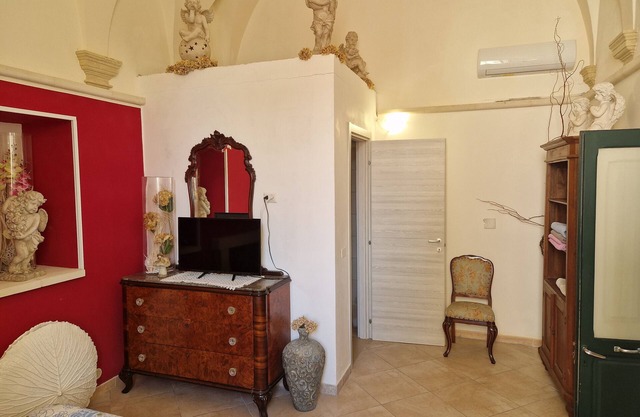 Habitación 'Palazzo Costantini - Girasole' con terraza compartida, Wi-Fi y aire acondicionado.