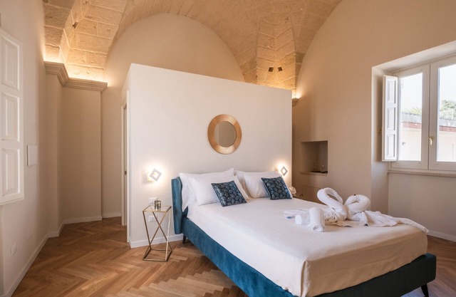 Habitación 'Relais Luxury Xenia - Ulivo' con piscina compartida, Wi-Fi y aire acondicionado.