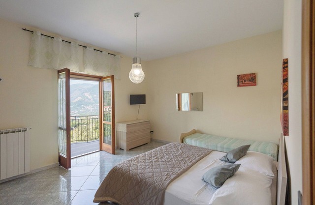 Habitación 'Tripla Con Vista Montagna' con vistas a la montaña, jardín compartido y Wi-Fi