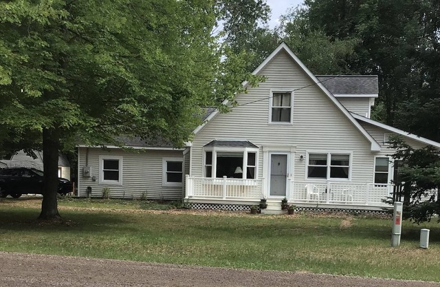 Roomy home with spacious fenced in backyard and fire pit.