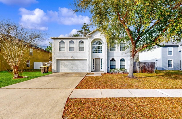 Serene home with enclosed yard and screened in back patio