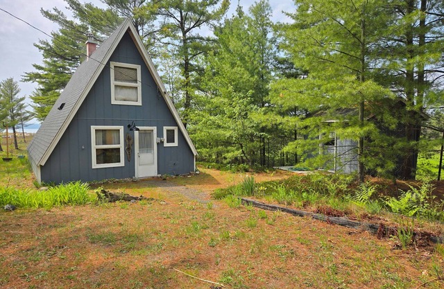 Rustic A-Frame Retreat on Grand Traverse Bay w/ beach, wifi, fire pit & grill