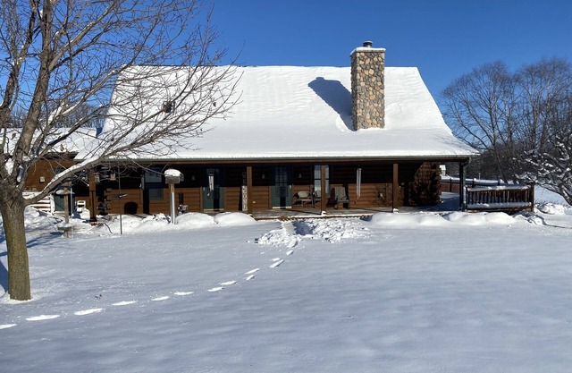 Rustic large log home w/3 full baths in country; midway between Madison & Milw