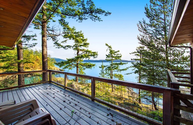 Rustic waterfront cabin w/ free WiFi, a full kitchen, & furnished decks