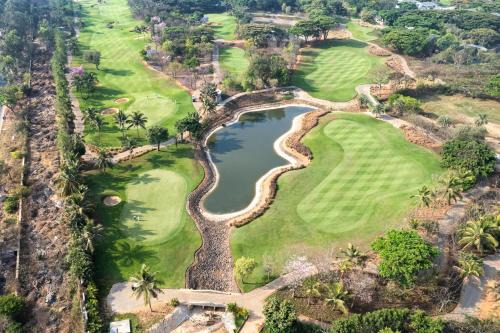 SaffronStays Niranta- 4-BDR villa on golf course near Bangalore