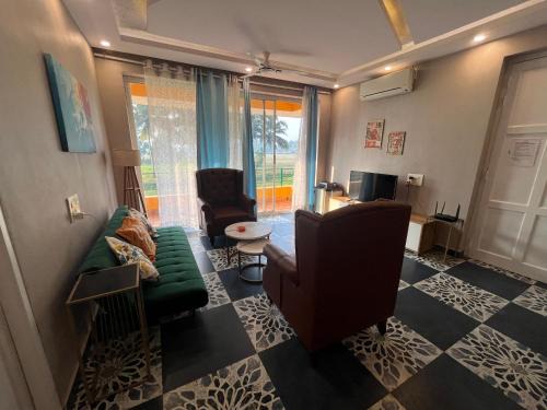 Sandy toes 2 bhk facing paddy field , pool available and walking distance to beach