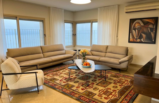 sea view penthouse with 3 floors and an hot tub! can host up to 15 people .