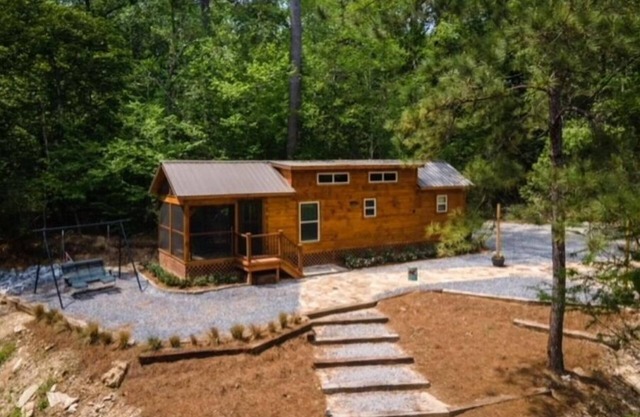 Secluded cozy tiny cabin on the water with fire pit and private dock