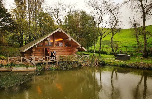 Secluded Log Cabin/Hot Tub On Private Laken1km to Jurassic Coast Pet friendly.