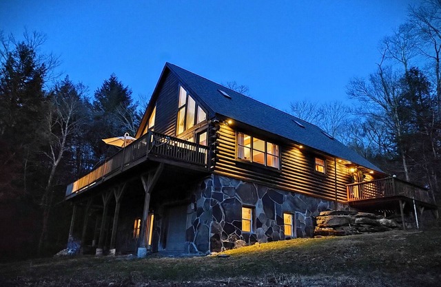 Secluded modern log cabin with picturesque private water fall on 12 acres!