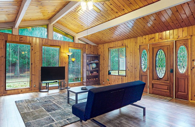 Secluded, single-level getaway with a large yard, gas fireplace, & washer/dryer