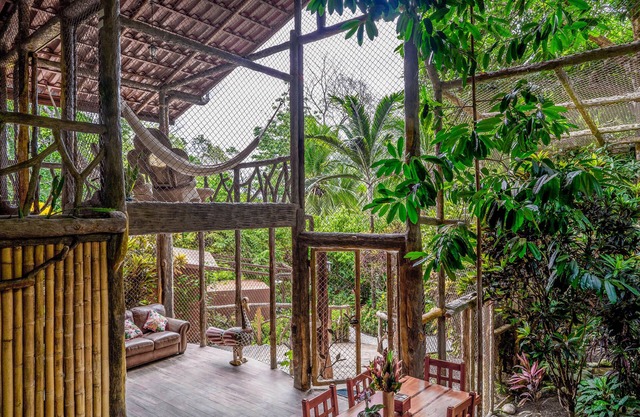 Secluded Treetop Home w/solar panels, Private Balcony, steps from the beach