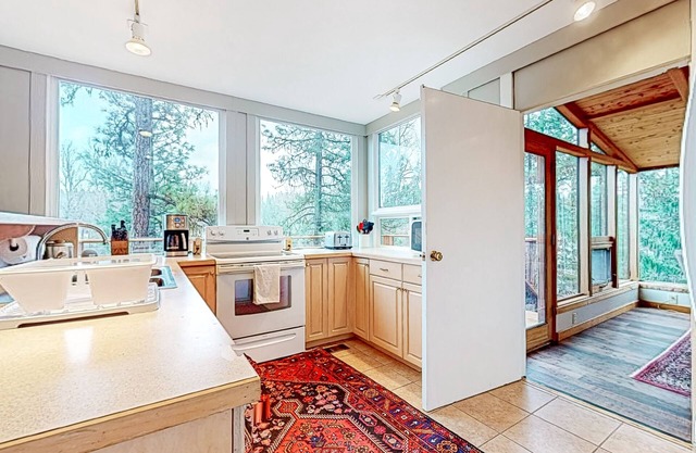 Secluded wilderness retreat with river views, wood stove, & grill - dog-friendly