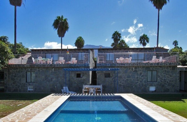 Semi-detached holiday home with pool and sea views