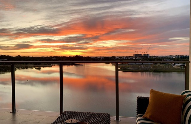Serene coastal waterfront apartment, private oasis, daily sunrises over ocean
