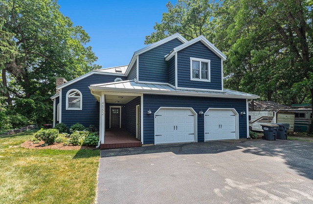 Serene lakefront retreat with an expansive deck, dock access, game room, & AC