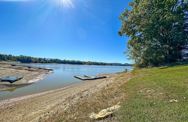 Serene lakefront home w/ free attraction tickets, dock, game room, & fire pit