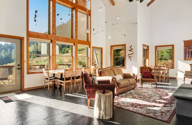 Ski-in/ski-out home with mountain-view balcony, multiple living areas, & W/D