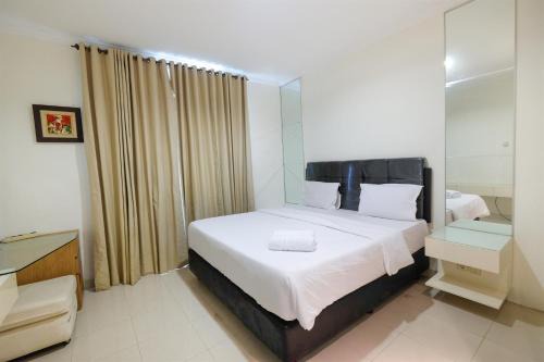 Spacious 2BR Bellezza Apartment By Travelio