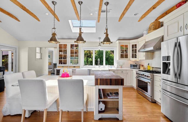 Spacious 4-BR house in lake community with beach access and swim-in-place spa.