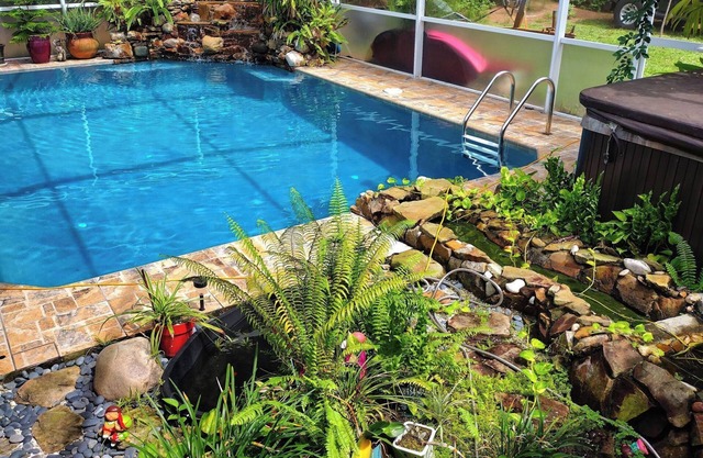 Spacious 5-bedroom Estate Home with a country club back porch pool & waterfall
